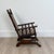 An American beechwood child's platform rocking chair, circa 1880.