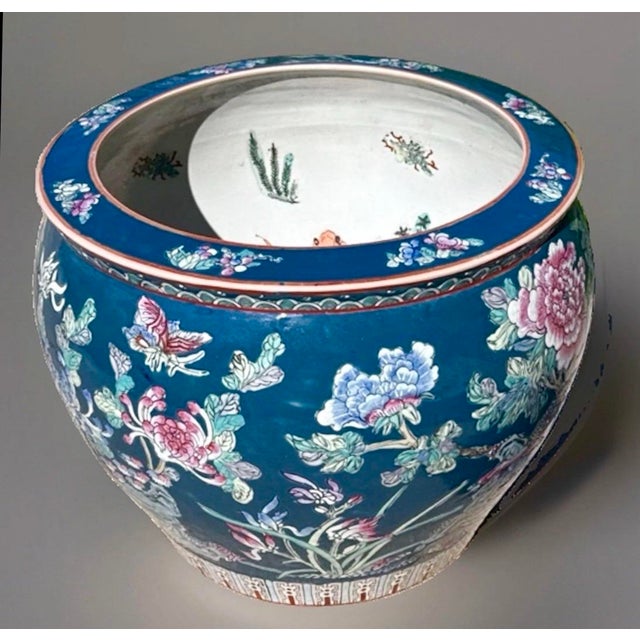 Large vintage Chinese export Famille Rose porcelain fishbowl planter on a wooden stand. Intricate hand painted interior...