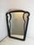 Beautiful Art Deco mirror with an ebony-effect wood frame. Attributable to Gio Ponti's design. The soft and refined shapes...