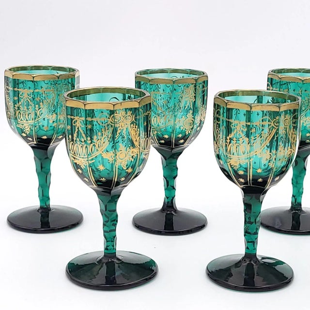 A set of eight French wine glasses, late 18th century. The glasses have a notched stem and octagonal bowl, decorated with...