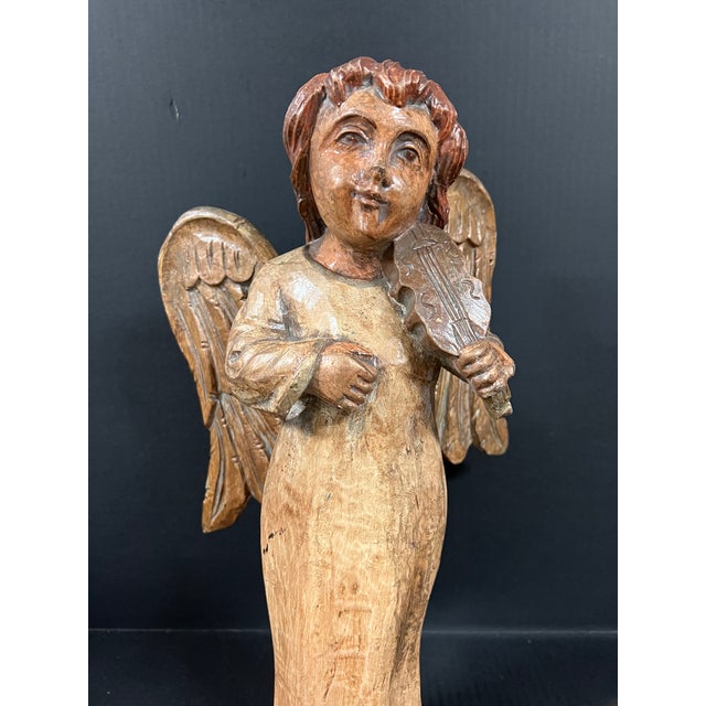ITEM NAME: Vintage Hand Carved Wood Standing Angel with Playing Violin Instrument Sculpture ORIGIN: Philippines AGES: Late...