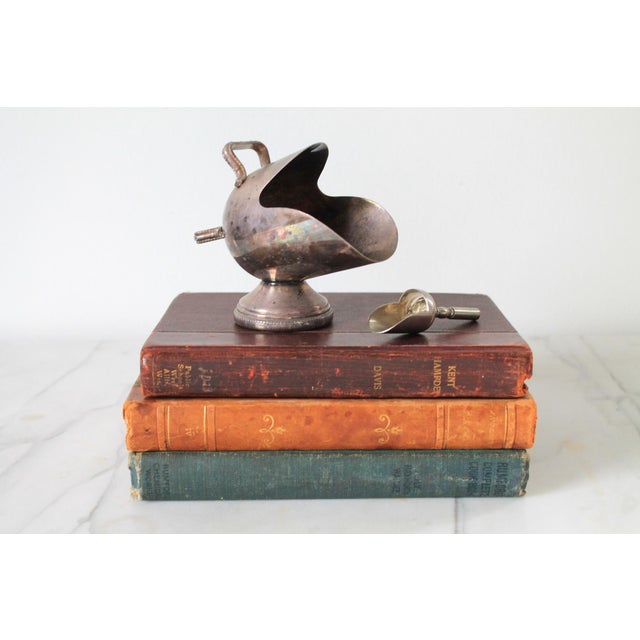 Vintage silver-plated sugar scuttle with a matching scoop, styled like a miniature coal scuttle. No makers mark. Tarnishing.