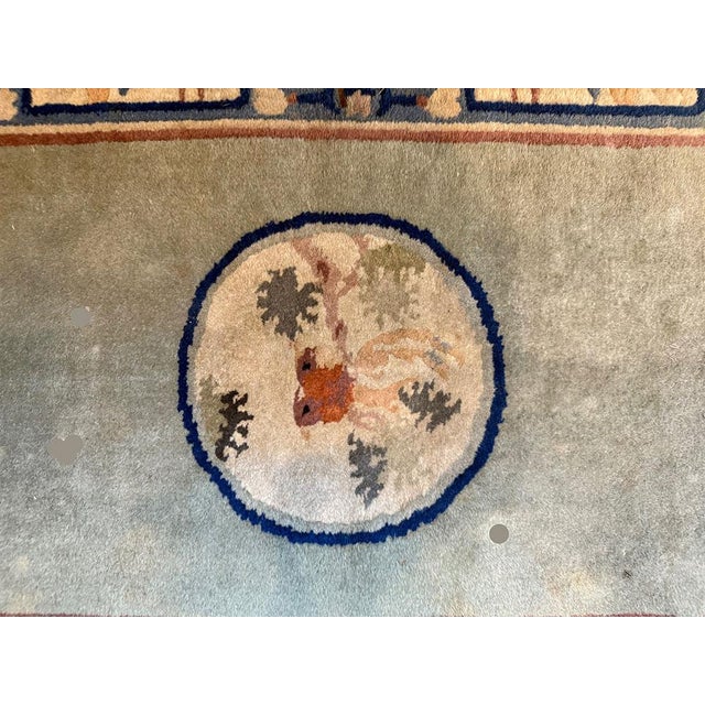 This vintage 2'x 4' Art Deco Chinese rug features a beautiful floral pattern in multicolor, hand-knotted from wool in...