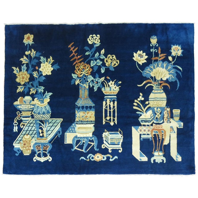 A Chinese pictographic rug in predominant shades blue. The wool is very soft and all the colors are natural. Soft on the...