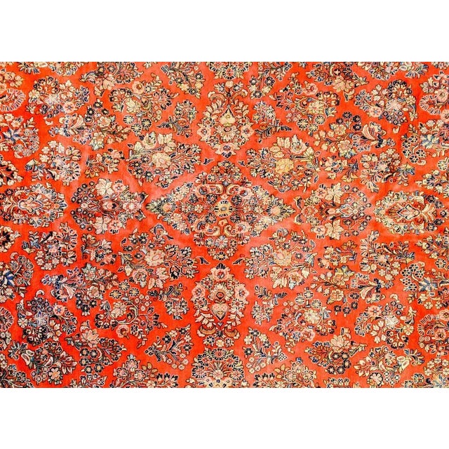 A wonderful early 20th century Persian Sarouk rug with a beautiful all-over mirror floral pattern woven in light and dark...