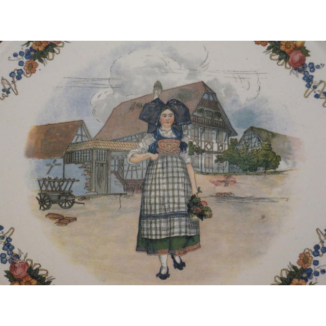 This French 12" serving platter handled plate from Sarreguemines Obernai is a vintage piece made of porcelain and ceramic...