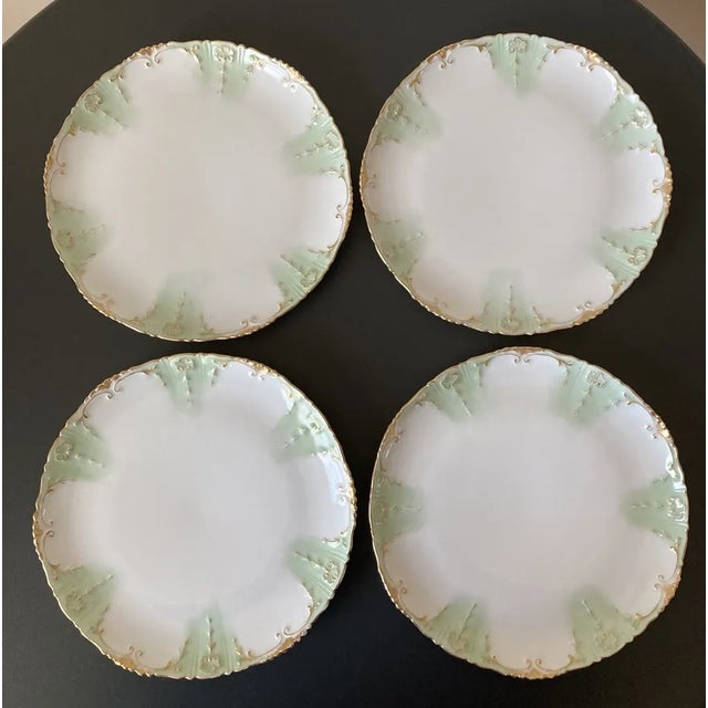 A beautiful set of four (4) French Limoges plates with green and gold accents, circa late 19th century, France, Europe....
