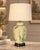 Ceramic table lamp in a ginger-jar shape, decorated with floral, botanical and butterfly motifs on a soft cream ground....