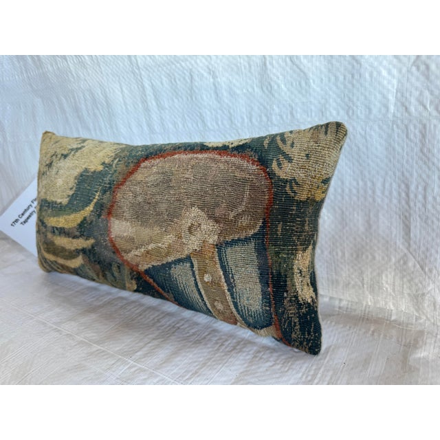 This antique decorative pillow is fashioned from an authentic 17th century Flemish tapestry fragment, handwoven in wool in...