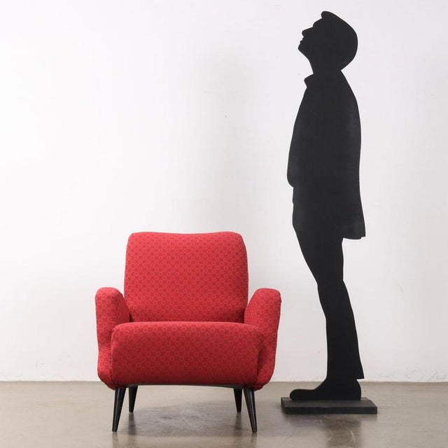 Armchair with foam padding, renewed upholstery, not original from the period and stained wooden legs. This piece is...