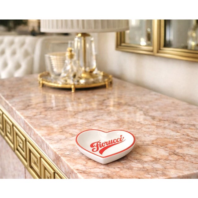 Offering a vintage 1980s Fiorucci "New Wave" Italian porcelain heart-shaped trinket dish, ashtray or vide poche. This rare...