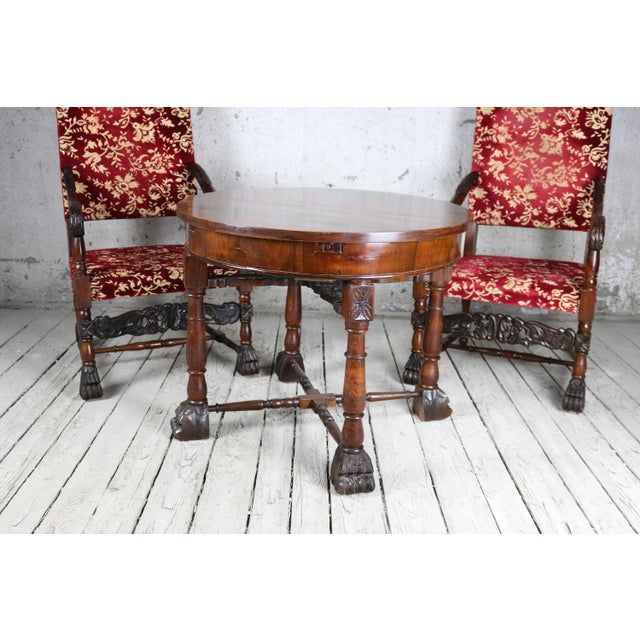 This elegant 19th century Renaissance Revival seating set with new upholstery and hand-carved walnut legs, circa 1870s. It...