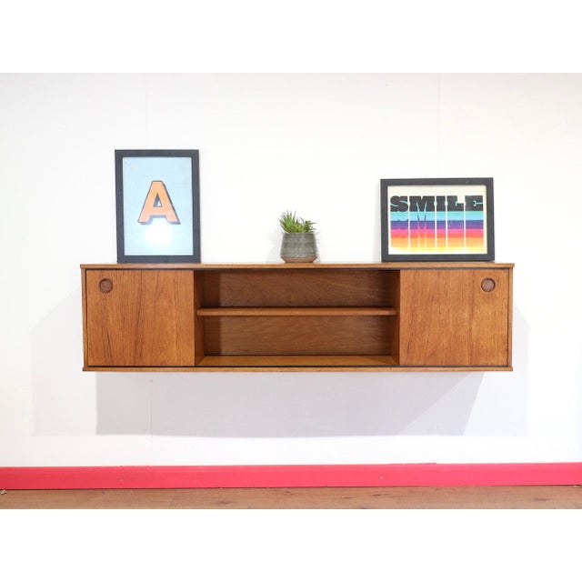 A beautiful wall mounted floating display cabinet in the styke of Avalon, this Mid Century Modern Teak Vintage Wall...