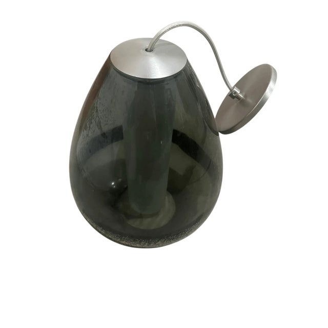 Good condition This contemporary hanging lamp features a captivating smoked grey glass shade with a unique glitter inlay...