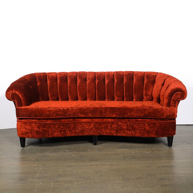 This elegant Art Deco curved sofa, crafted in the United States circa 1940, is a stunning example of the design and...