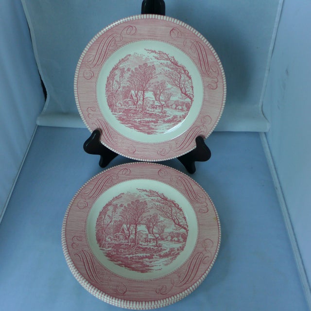 Offered is a set of four dinner plates in pink and white, with village pattern, makers mark reads " Royal Ironstone Made...