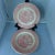 Offered is a set of four dinner plates in pink and white, with village pattern, makers mark reads " Royal Ironstone Made...
