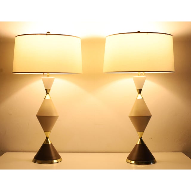 Eternally graceful, these lamps just beautiful. Porcelain and Brass in an hourglass shape. It is difficult to find a pair...
