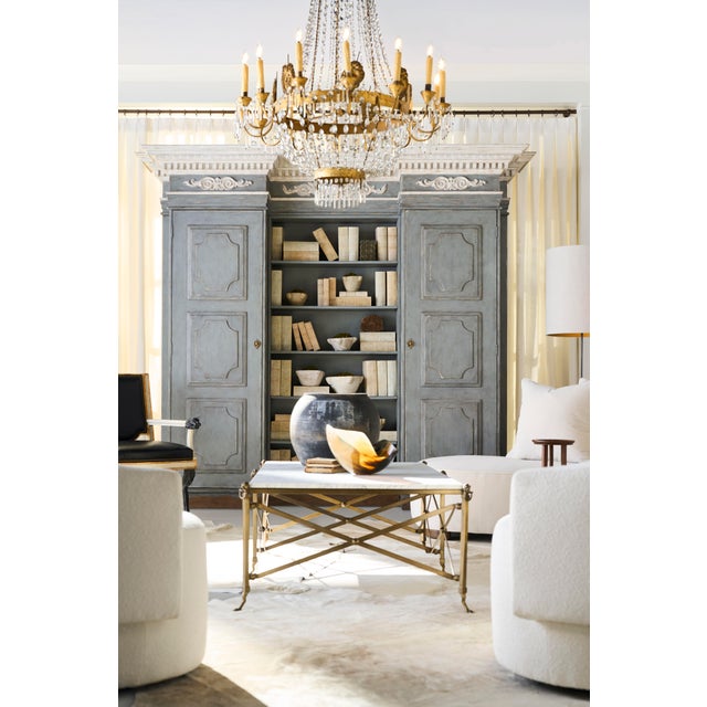 Inspired by a 19th-century French bibliothèque with neoclassical dental molding cornice and raised panel doors exemplifies...