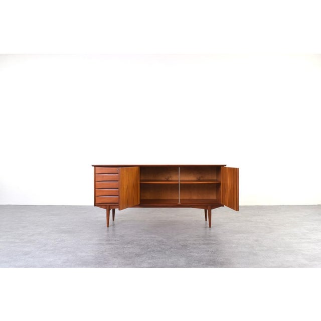 This teak sideboard was designed by Norwegian designer Fredrik Kayser in the 1960s and produced in Norway. The piece has...