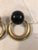 This fabulous pair of 1970s Trifari Black Enamel & Gold Door Knocker Earrings will be the eye-catching accessory your...
