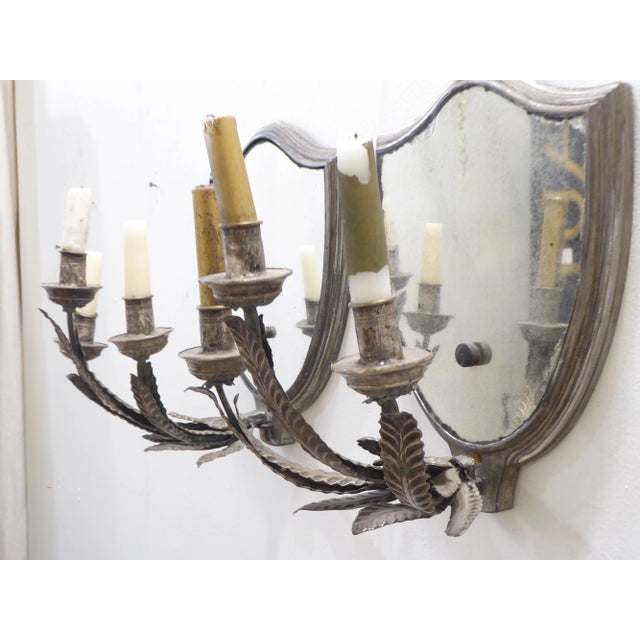 Pair of 18th Century Italian silvered metal wall sconces with 20th Century mirrored back plates added..