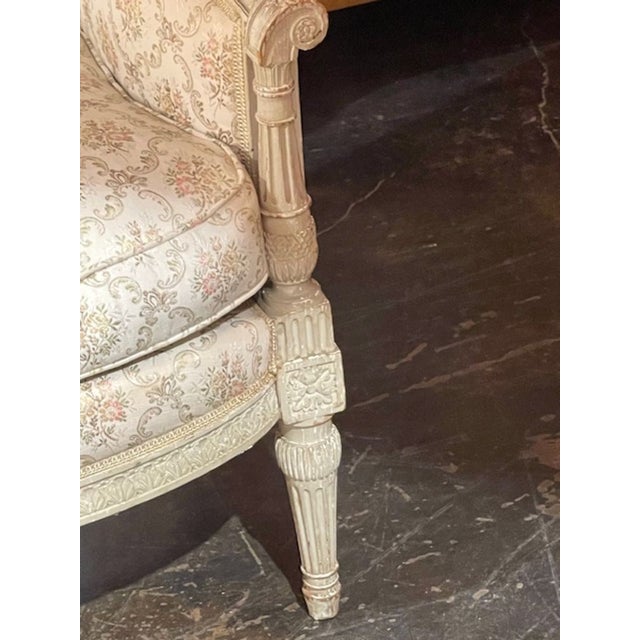 This product is a pair of 19th century French Louis XVI armchairs. with a floral upholstery The armchairs have a beautiful...