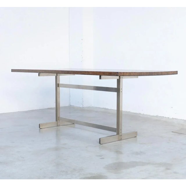 This exclusive dining table was designed by Jules Wabbes for Mobilier Universel in 1959. The rectangle top is made of...