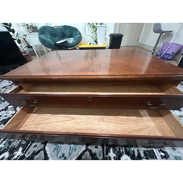 Solid wood coffee table with light wear. Excellent addition to your home for a steal!