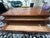 Solid wood coffee table with light wear. Excellent addition to your home for a steal!