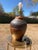 This is a vintage mid century ceramic table lamp by Elite, featuring a substantial urn-shaped base with carved geometric...