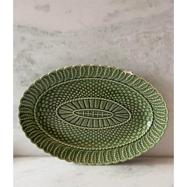 Vintage Bordallo Pinheiro ceramic serving dish in the glazed green basketweave pattern.