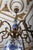 Brass chandelier decorated with hand-painted delft elements. The arms are figuratively decorated with fish. The top part...