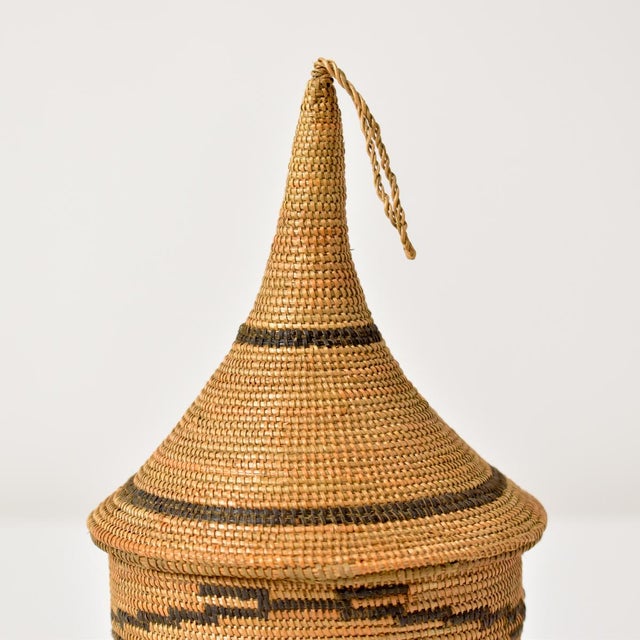 Tutsi Tight Weave Basket with Lid – A Masterpiece of Rwandan Artistry The Tutsi Tight Weave Basket with Lid is a stunning...