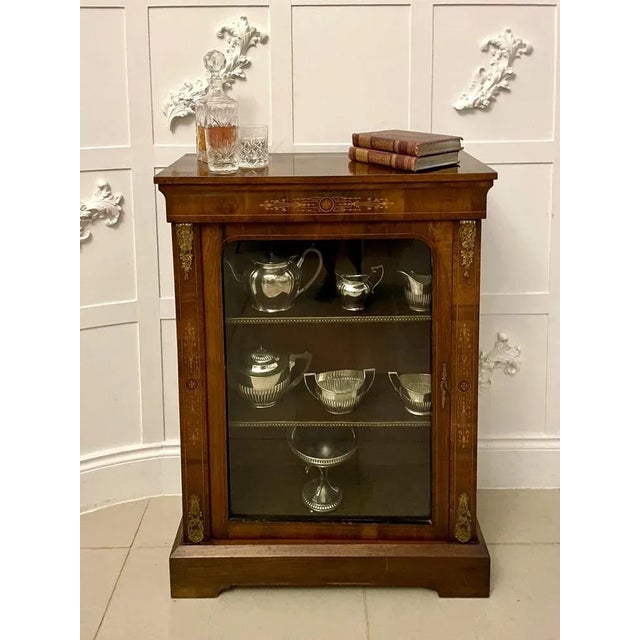 Antique Victorian quality figured walnut satinwood inlaid display cabinet having a quality figured walnut top above a...