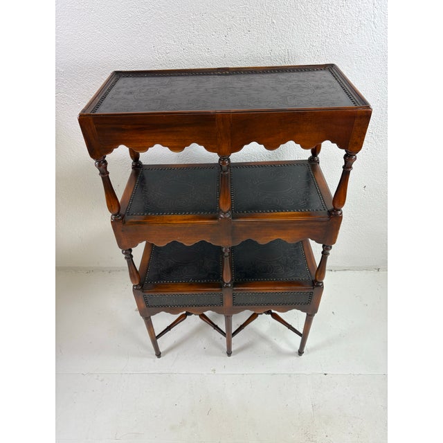 This is a handsome walnut and brass etagere by Theodore Alexander. This etagere features a beautifully finished dark...