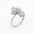 Originally a vintage Art Deco era stick pin (circa 1920s to 1930s), the stylized clover is crafted in 14 karat white gold...