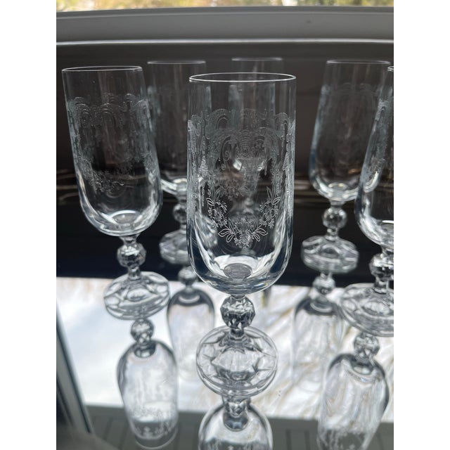 Celebrate in style with Vintage lacey etched champagne glasses. Finely delicately etched floral design. Glasses measure 6...