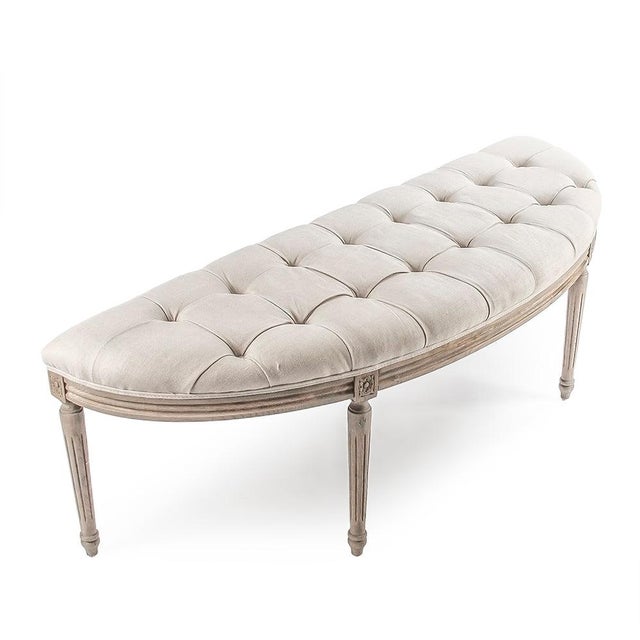The Louis Curve Bench from Zentique is a French Louis XVI demilune bench with a natural linen padded seat on a stained oak...