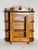 Antique oak multitier display case with glass door.