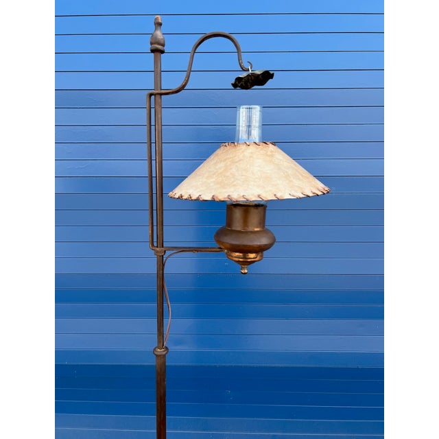 An original Monterey floor lamp from the 1930s, blending wood with hand-worked copper and wrought iron details in the...