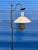 An original Monterey floor lamp from the 1930s, blending wood with hand-worked copper and wrought iron details in the...