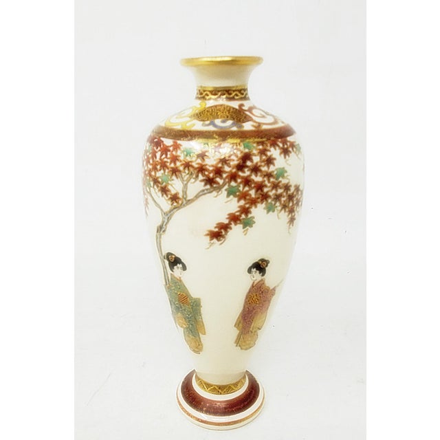 This antique Japanese Satsuma 6" vase from the late Meiji era features a beautiful design of two women or geisha, an...
