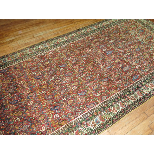 A colorful vintage Persian Malayer rug from the early 20th century. Measures: 4'10'' x 9'10''.