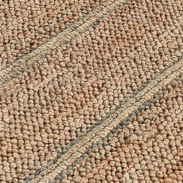 Hand woven natural jute rug with subtle gray striped detail. Please note that its appearance may vary depending on...