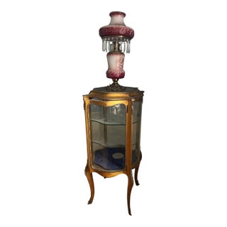 Antique French-Style Vitrine or Curio Cabinet. It Features a Giltwood Frame, Curved Glass Panels, and Cabriole Legs. For Sale