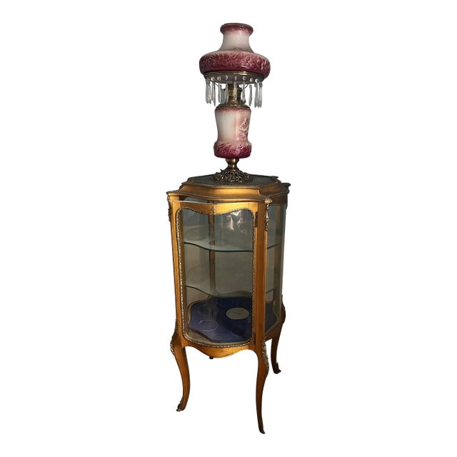 Antique French-Style Vitrine or Curio Cabinet. It Features a Giltwood Frame, Curved Glass Panels, and Cabriole Legs. For Sale