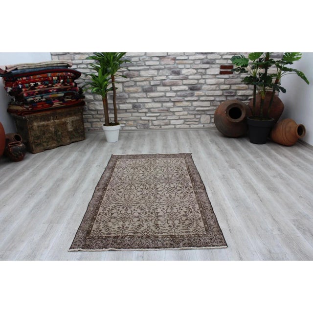 This gorgeous hand knotted Vintage Anatolian area rug is approximately 60 years old in excellent vintage condition. The...