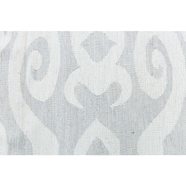 A contemporary interpretation of timeless textile artistry, this Modern Kilim flat-weave rug exemplifies the beauty of...