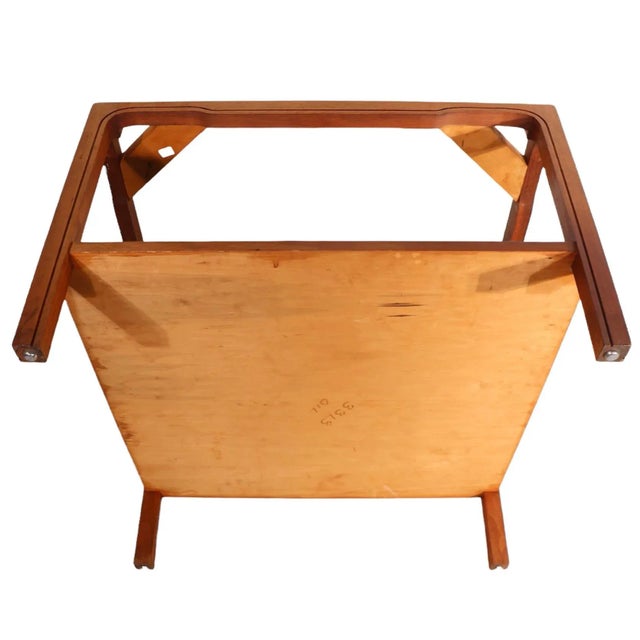 Hollywood Regency, Asia Modern, Chinese influenced marble top side, or end, table having a stylized wood base and thick (...